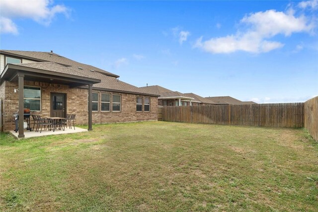 345 Coba St, Leander, TX 78641 - fenced backyard with a patio area