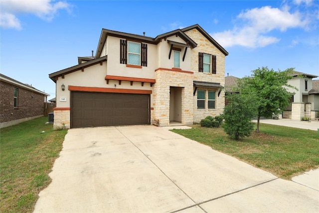 345 Coba St, Leander, TX 78641 - view of front of home featuring stone siding, stucco siding, concrete driveway, a front lawn, and a garage