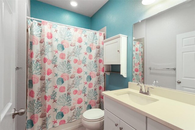 345 Coba St, Leander, TX 78641 - full bathroom featuring vanity, toilet, and recessed lighting