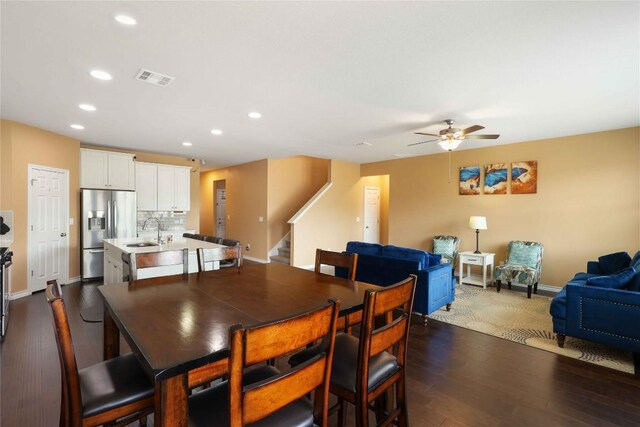 345 Coba St, Leander, TX 78641 - dining space with stairway, ceiling fan, dark wood finished floors, and recessed lighting
