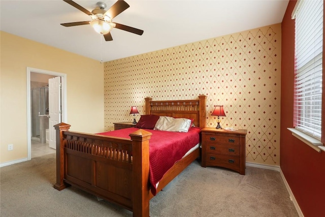 345 Coba St, Leander, TX 78641 - carpeted bedroom featuring baseboards, a ceiling fan, ensuite bathroom, and wallpapered walls