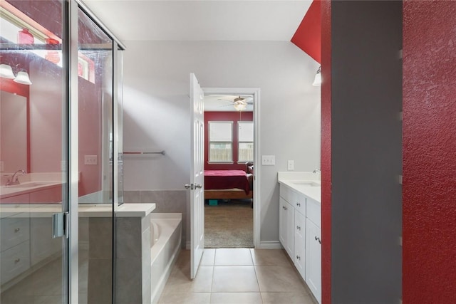 345 Coba St, Leander, TX 78641 - bathroom with vanity, ensuite bathroom, a garden tub, tile patterned flooring, and ceiling fan