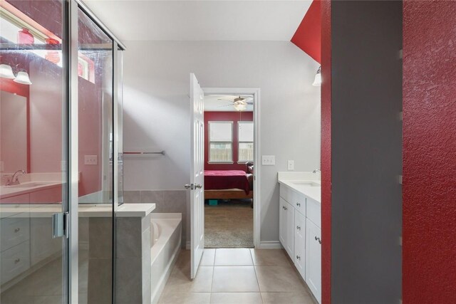 345 Coba St, Leander, TX 78641 - full bathroom with vanity, ensuite bathroom, a bath, tile patterned floors, and ceiling fan