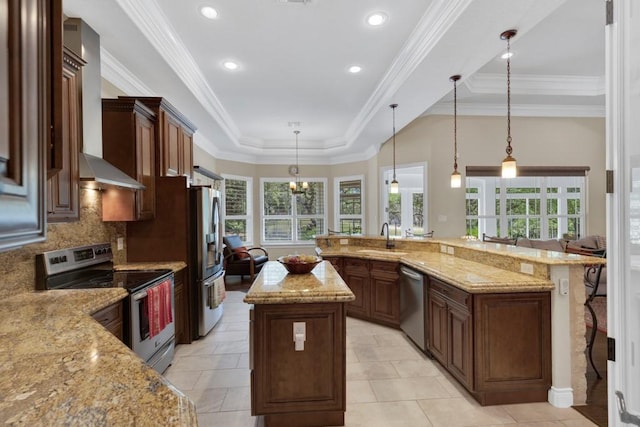 1164 Fairway Dr, Canyon Lake, TX 78133 - kitchen featuring stainless steel appliances, a sink, a spacious island, wall chimney range hood, and light stone countertops