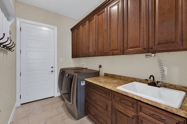 1164 Fairway Dr, Canyon Lake, TX 78133 - clothes washing area with cabinet space, a sink, independent washer and dryer, and baseboards