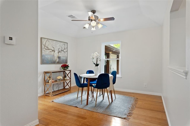 104 Tonkawa Cv, Kyle, TX 78640 - dining room featuring wood finished floors, a ceiling fan, and baseboards