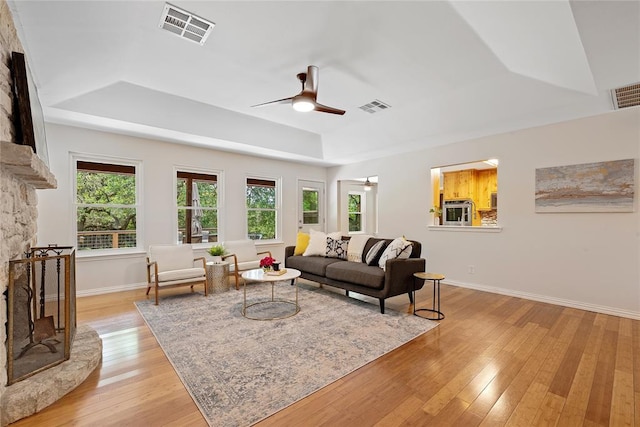 104 Tonkawa Cv, Kyle, TX 78640 - living area featuring ceiling fan, a tray ceiling, and visible vents