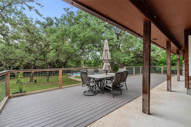 104 Tonkawa Cv, Kyle, TX 78640 - wooden deck with a yard and outdoor dining space