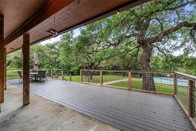 104 Tonkawa Cv, Kyle, TX 78640 - wooden deck featuring a fenced in pool, outdoor dining area, and a yard