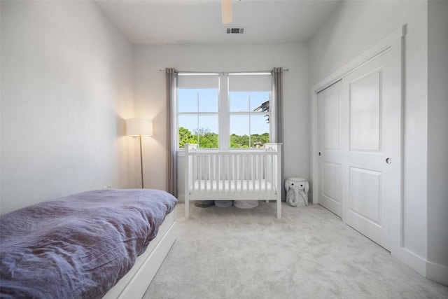 bedroom featuring visible vents and carpet