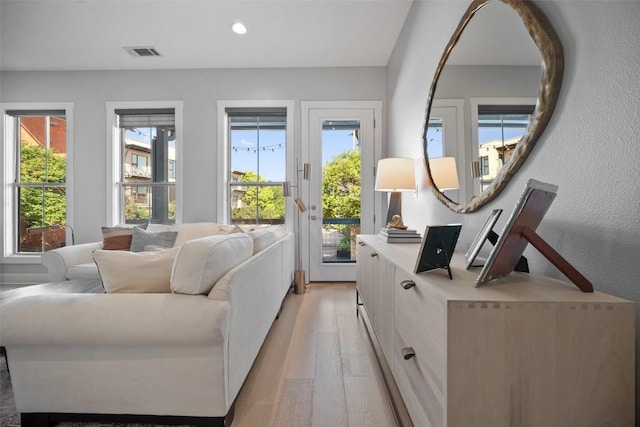 interior space with recessed lighting, visible vents, and light wood finished floors