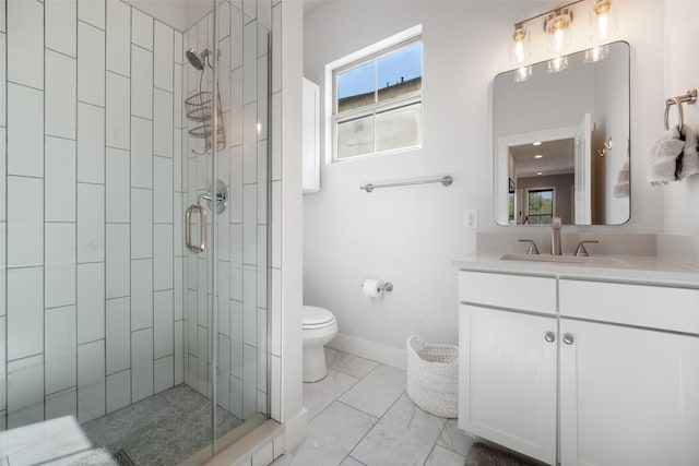 full bathroom with toilet, a stall shower, baseboards, marble finish floor, and vanity