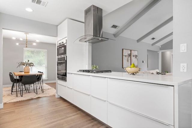 kitchen with range hood, stainless steel gas cooktop, light wood-type flooring, white cabinetry, and visible vents