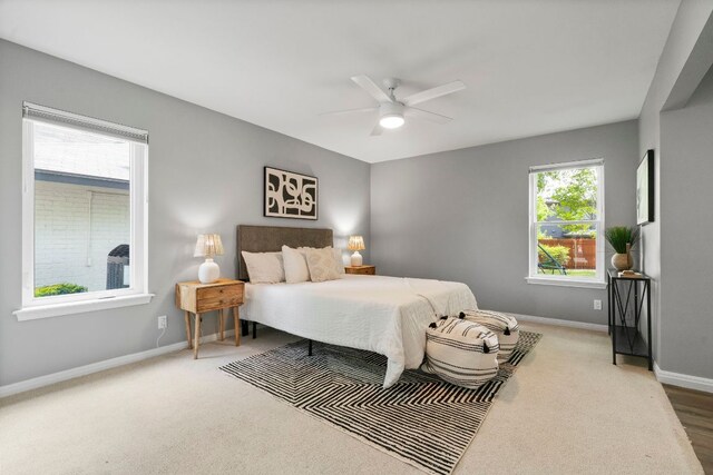 bedroom with baseboards, carpet floors, and ceiling fan
