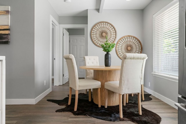 dining room with wood finished floors and baseboards