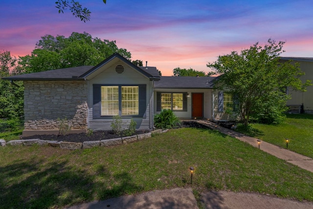 3212 Darnell Dr, Austin, TX 78745 - ranch-style house with a lawn and stone siding