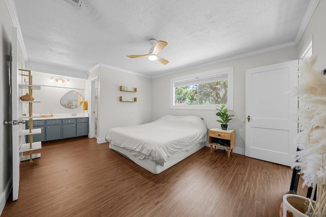 3212 Darnell Dr, Austin, TX 78745 - bedroom featuring wood finished floors, a textured ceiling, crown molding, and a ceiling fan
