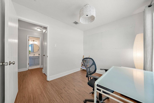 3212 Darnell Dr, Austin, TX 78745 - office area featuring wood finished floors and ornamental molding