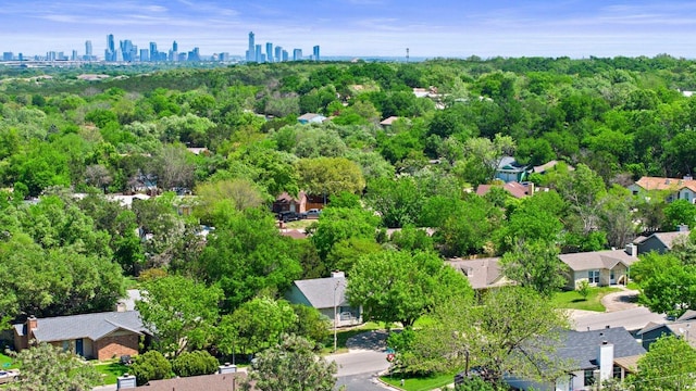 3212 Darnell Dr, Austin, TX 78745 - aerial perspective of suburban area with city skyline