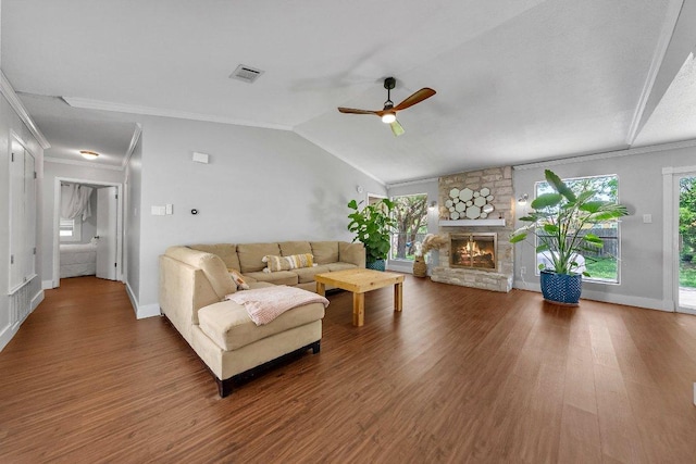 3212 Darnell Dr, Austin, TX 78745 - living room with wood finished floors, a ceiling fan, crown molding, a fireplace, and lofted ceiling