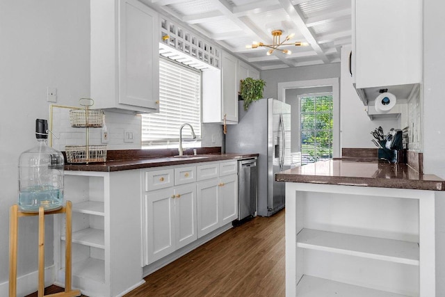 3212 Darnell Dr, Austin, TX 78745 - kitchen featuring open shelves, appliances with stainless steel finishes, a chandelier, dark wood-type flooring, and white cabinets