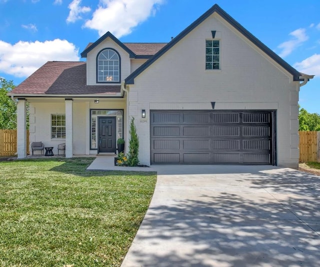 11255 Avering Ln, Austin, TX 78754 - view of front of property featuring a front yard, driveway, a garage, and fence