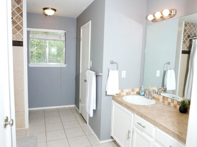 1015 Acanthus St, Pflugerville, TX 78660 - full bath featuring vanity, tile patterned flooring, and baseboards