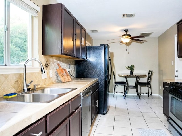 1015 Acanthus St, Pflugerville, TX 78660 - kitchen with a sink, decorative backsplash, range with gas cooktop, ceiling fan, and healthy amount of natural light