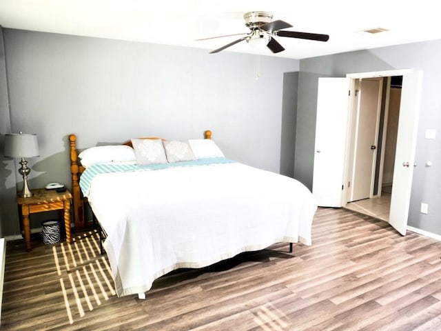 1015 Acanthus St, Pflugerville, TX 78660 - bedroom featuring wood finished floors, ceiling fan, and baseboards