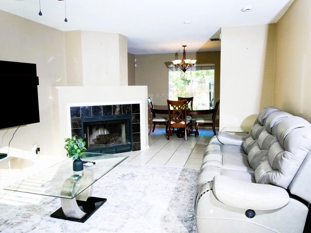 1015 Acanthus St, Pflugerville, TX 78660 - living area featuring a chandelier, light tile patterned floors, and a fireplace