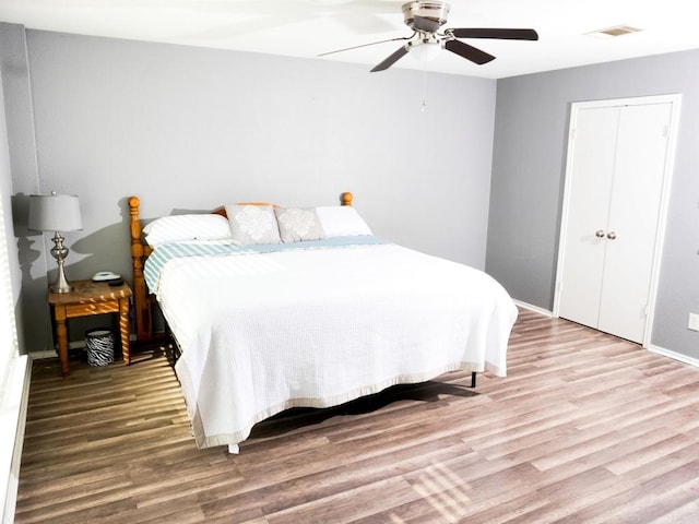 1015 Acanthus St, Pflugerville, TX 78660 - bedroom featuring wood finished floors, ceiling fan, and baseboards