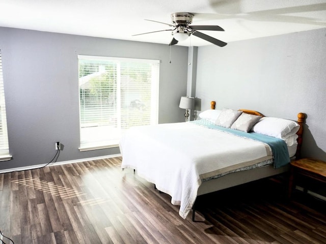 1015 Acanthus St, Pflugerville, TX 78660 - bedroom featuring wood finished floors, a ceiling fan, and baseboards