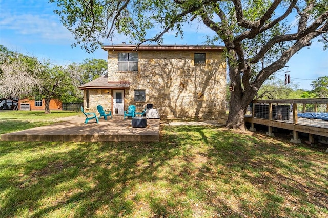 7557 Chaparral Rd, Killeen, TX 76542 - rear view of property with a lawn, stone siding, a patio, and a deck