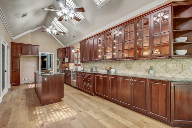 36 Cottondale Rd, The Hills, TX 78738 - kitchen featuring appliances with stainless steel finishes, a ceiling fan, dark stone counters, light wood finished floors, and high vaulted ceiling