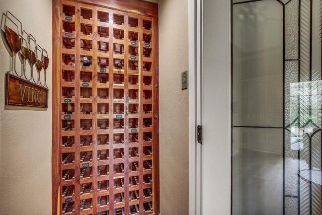36 Cottondale Rd, The Hills, TX 78738 - wine area featuring a textured wall