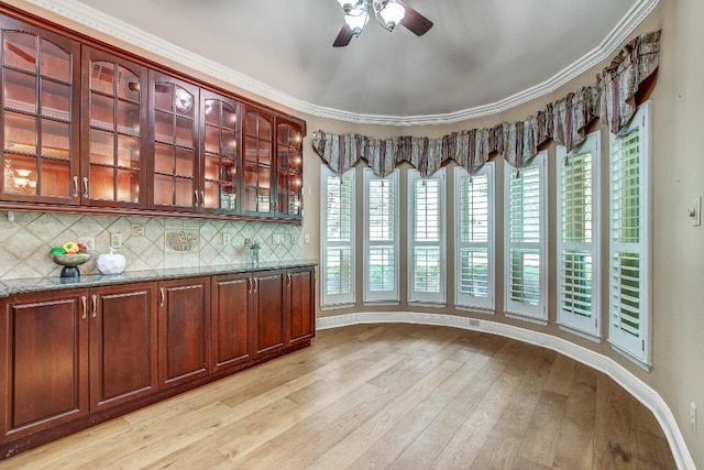 36 Cottondale Rd, The Hills, TX 78738 - bar area with a ceiling fan, light wood-type flooring, decorative backsplash, and crown molding