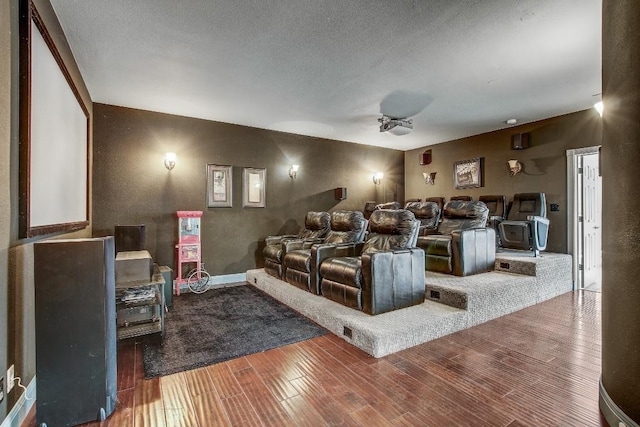36 Cottondale Rd, The Hills, TX 78738 - home theater room with wood finished floors and a textured ceiling