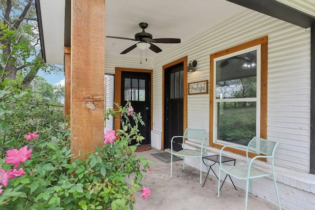 view of exterior entry featuring a ceiling fan