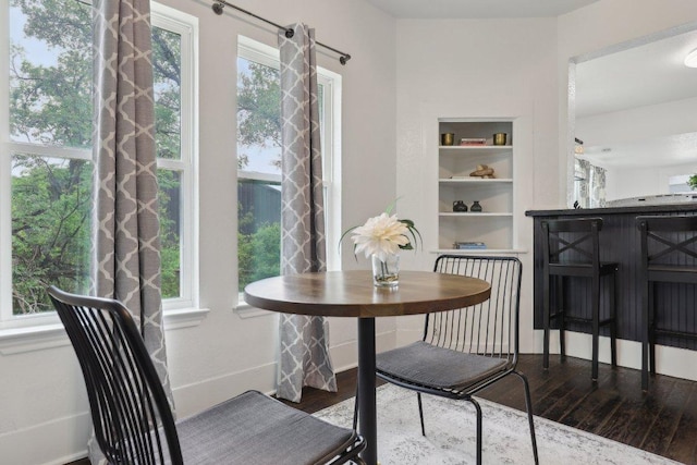 dining space featuring wood finished floors