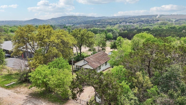aerial view featuring a view of trees and a mountain view
