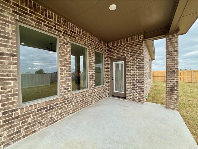 view of patio featuring fence