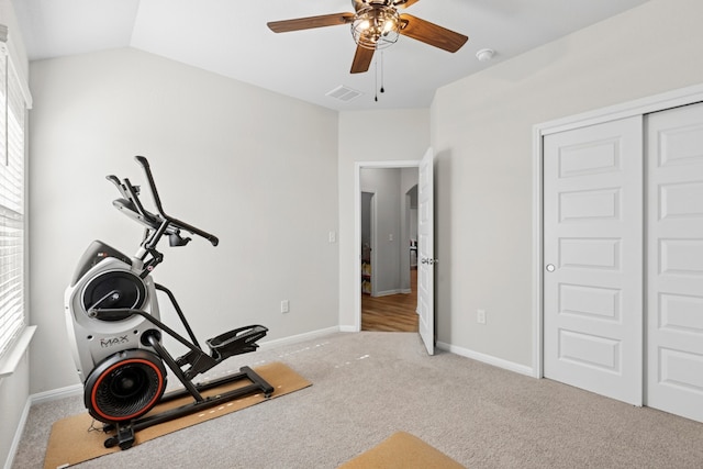 185 Dogvane Cir, Kyle, TX 78640 - exercise area with ceiling fan, baseboards, light colored carpet, and lofted ceiling
