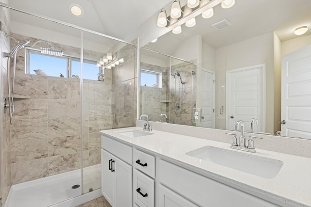 185 Dogvane Cir, Kyle, TX 78640 - full bath with a stall shower, healthy amount of natural light, and double vanity