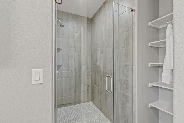 23315 Nameless Rd, Leander, TX 78641 - bathroom with a stall shower and a textured wall