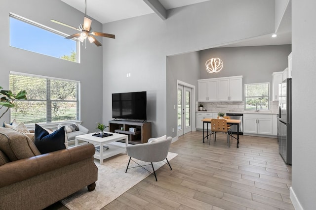 23315 Nameless Rd, Leander, TX 78641 - living area with a towering ceiling, recessed lighting, ceiling fan, baseboards, and light wood-style floors