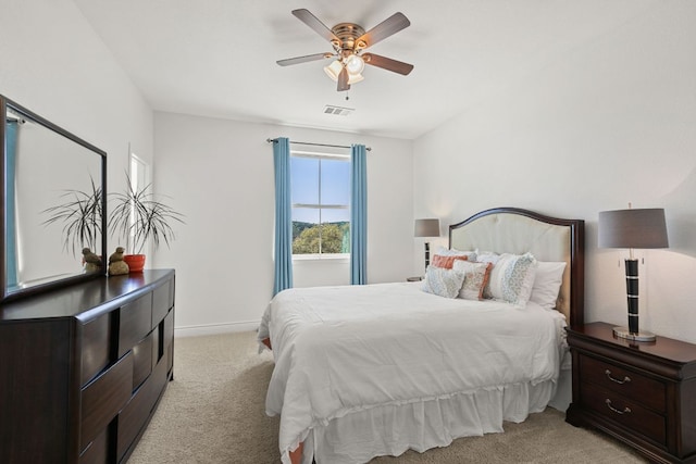 23315 Nameless Rd, Leander, TX 78641 - bedroom with baseboards, light carpet, visible vents, and a ceiling fan