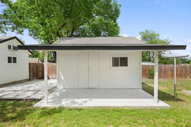 view of shed with a fenced backyard