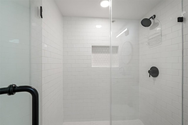 bathroom with a shower stall
