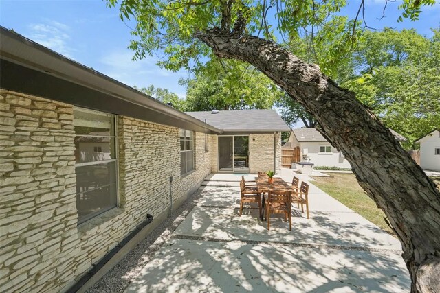 view of patio / terrace featuring outdoor dining area and fence