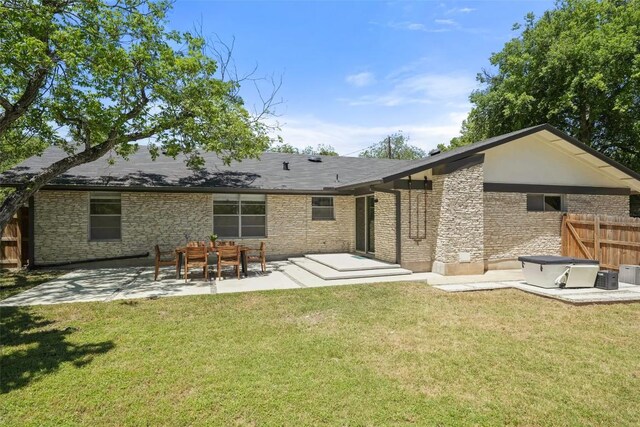 back of house featuring a yard, a patio area, central AC unit, and fence